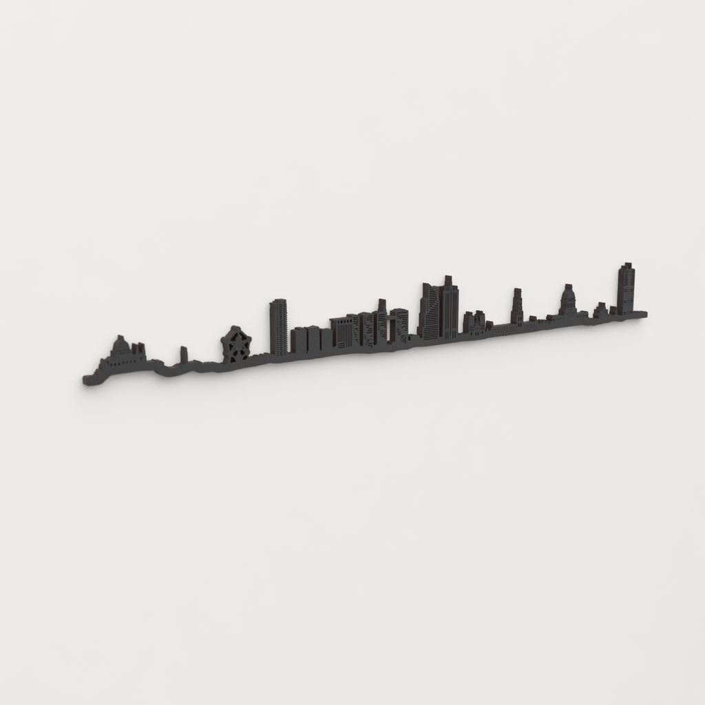Vista en perspectiva de la silueta del skyline de Bruxelles en madera negra.