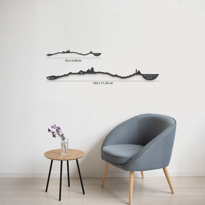 Comparativa de tamaños 50 cm y 100 cm de la silueta de Tarragona en una pared de salón.