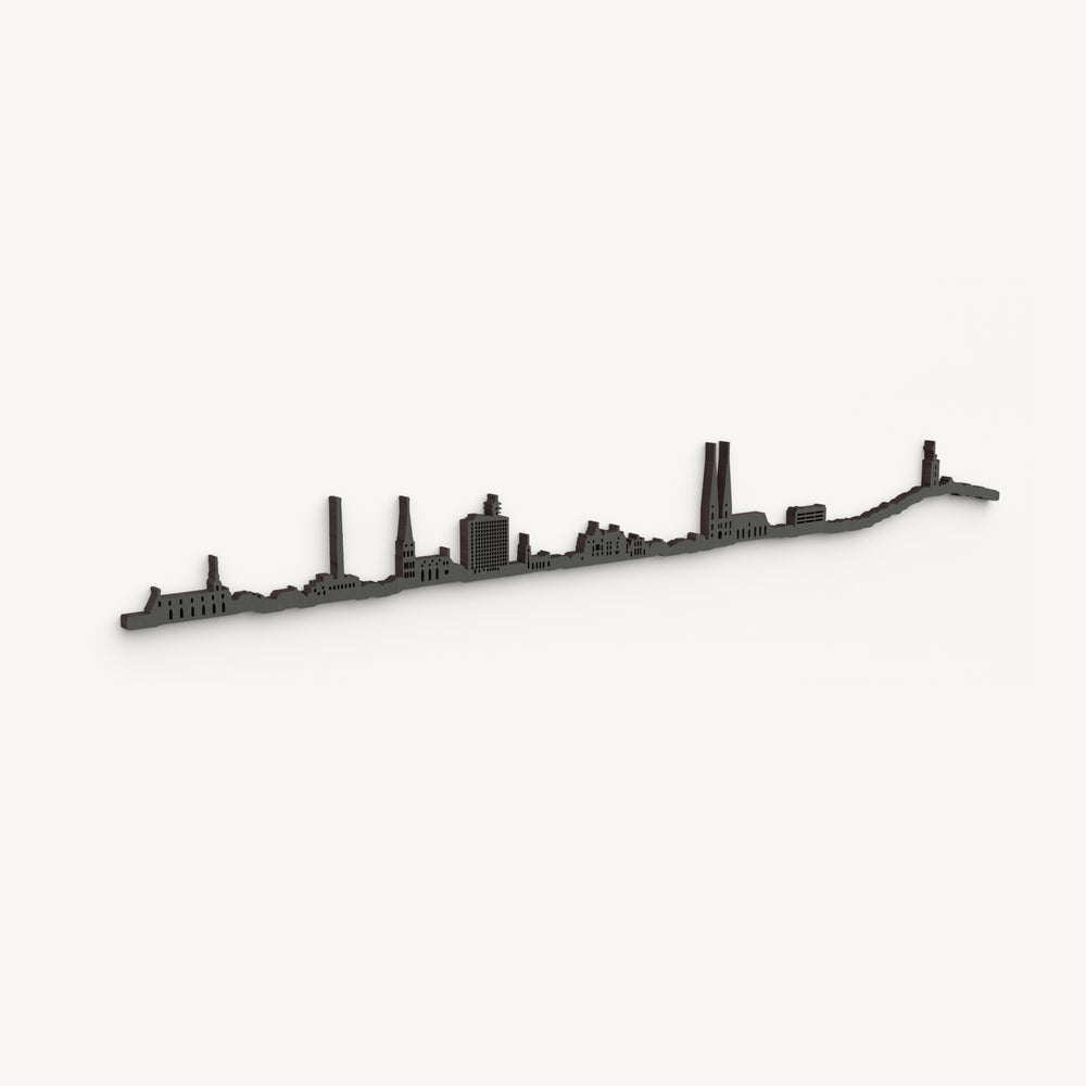 Skyline de Bielefeld en negro, en perspectiva diagonal sobre fondo blanco, con sus edificios y cortes pasantes.