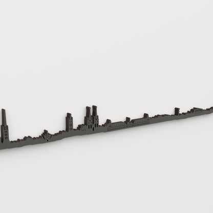 Detalle del skyline de Burdeos en acabado negro, con ventanas recortadas y relieve de madera.