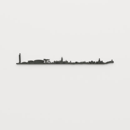 Vista frontal del skyline de Glasgow en acabado negro, con sus edificios y huecos recortados sobre pared clara.