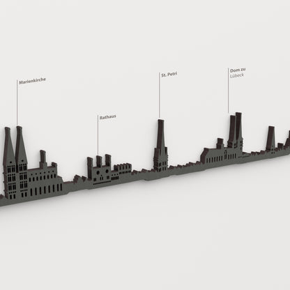 Skyline de Lübeck en acabado negro con nombres de Marienkirche, Rathaus, St. Petri, Dom zu Lübeck.