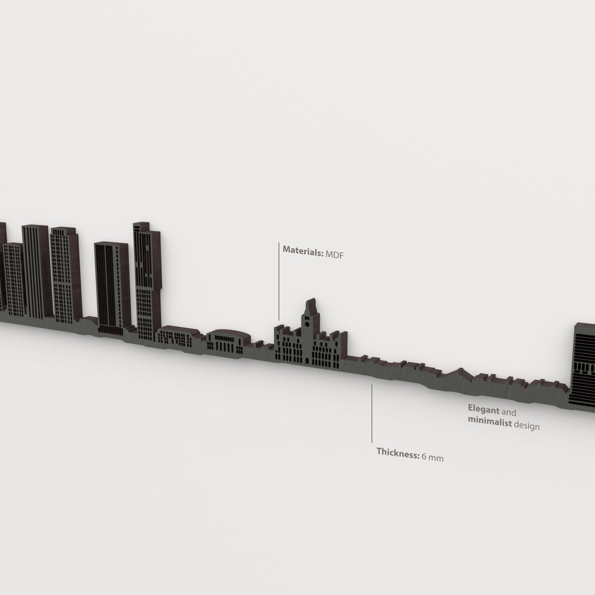 Detalle del skyline de Manchester en acabado negro, con indicaciones de material y grosor de 6 mm.