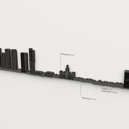 Detalle del skyline de Manchester en acabado negro, con indicaciones de material y grosor de 6 mm.