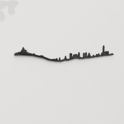 Vista en perspectiva de la silueta del skyline de Bologna en madera negra.