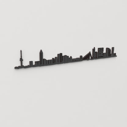 Vista en perspectiva de la silueta del skyline de Rotterdam en madera negra.