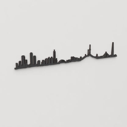 Vista en perspectiva de la silueta del skyline de Seoul en madera negra.