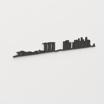 Vista en perspectiva de la silueta del skyline de Singapore en madera negra.